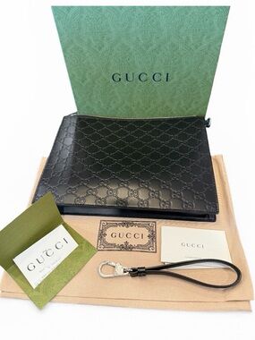 Gucci UNISEX Black Embossed GG Leather Pouch with Wrist Strap